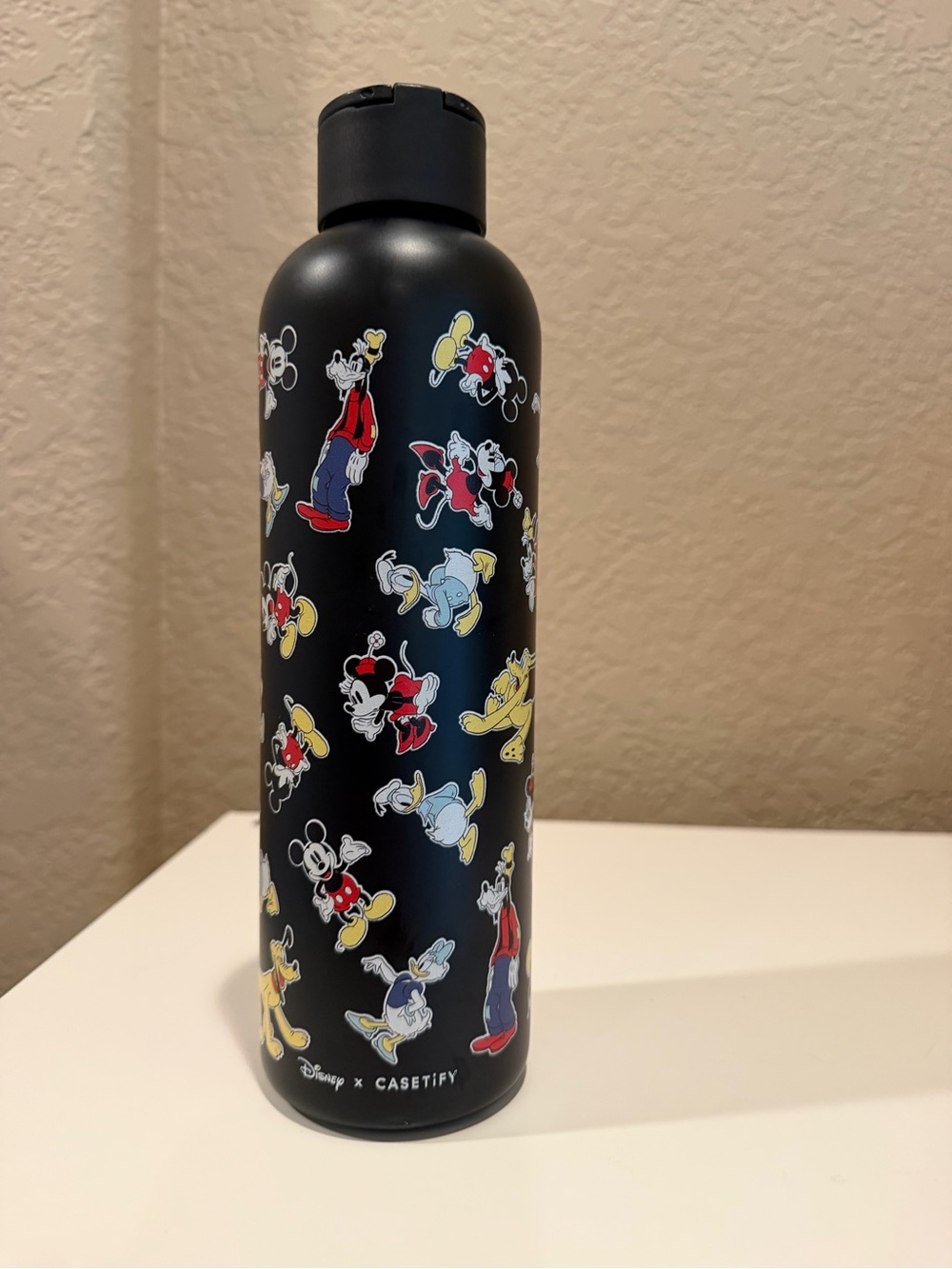 Casetify Black Bottle with Multicolor Disney Characters
